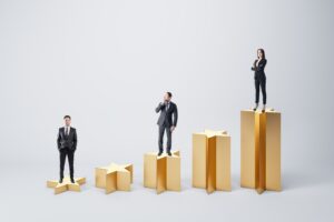 Menschen stehen auf goldenen Sternen unterschiedlicher Größe.